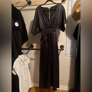 Black with a micro animal print, satin material. Kimono sleeves. Pockets. NWT